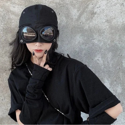 “DeathVision: Aviator Shade Cap for Rebels, Ragers & Runaways” – Built-In Sunglasses Hat for Those Who Don’t Just Dodge the Sun… They Dodge the Law