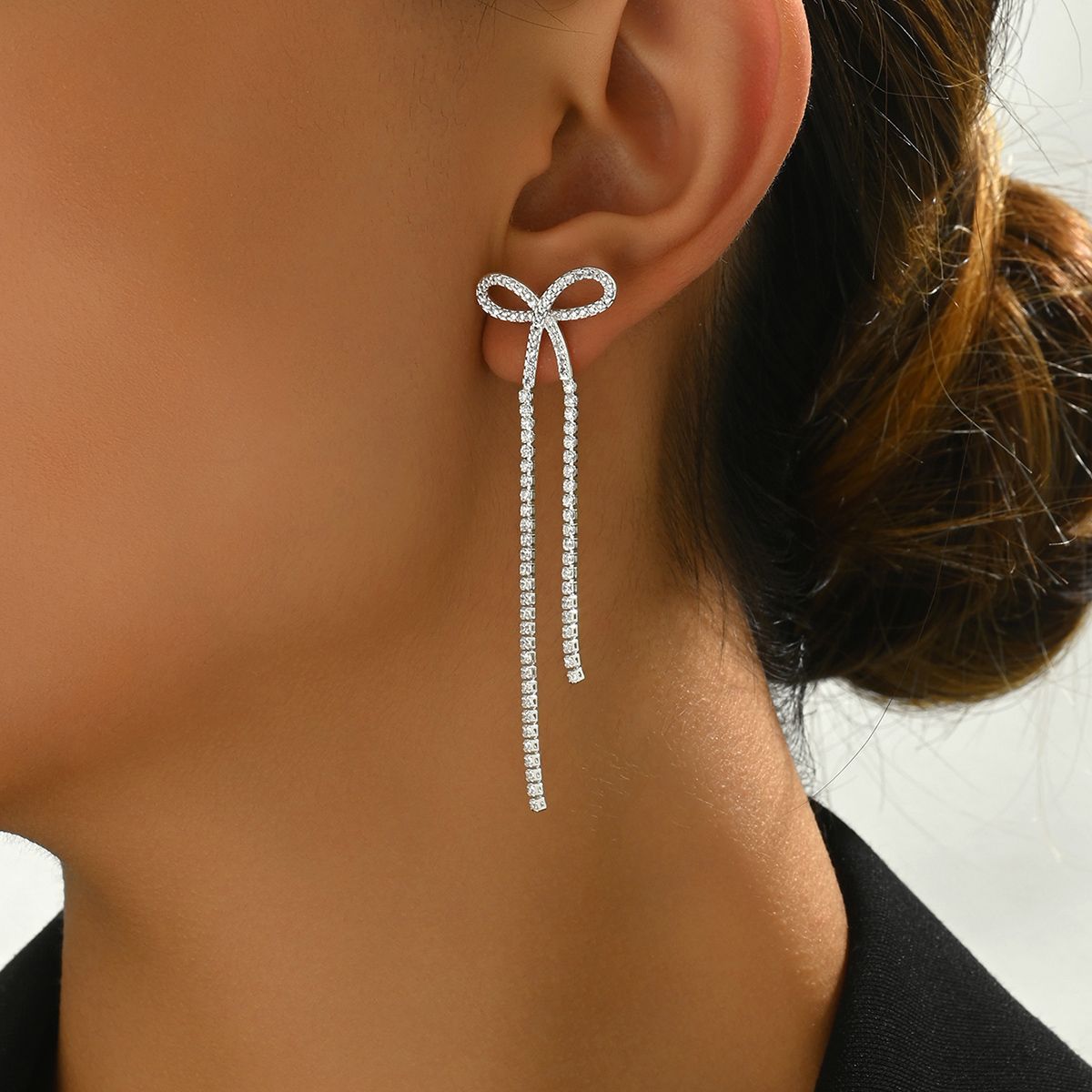 "Women's bridal silver bow rhinestone earrings Women's pendant earrings  Chandelier tassel earrings Sparkling crystal earrings Halloween long pendant earrings"