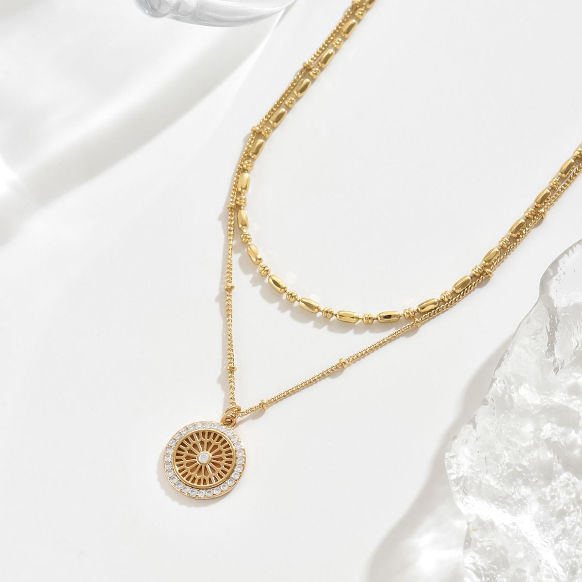 "Elegant Gold Layered Necklace Set with Crystal Medallion  Pendant - Chic and Versatile Jewelry for Women"