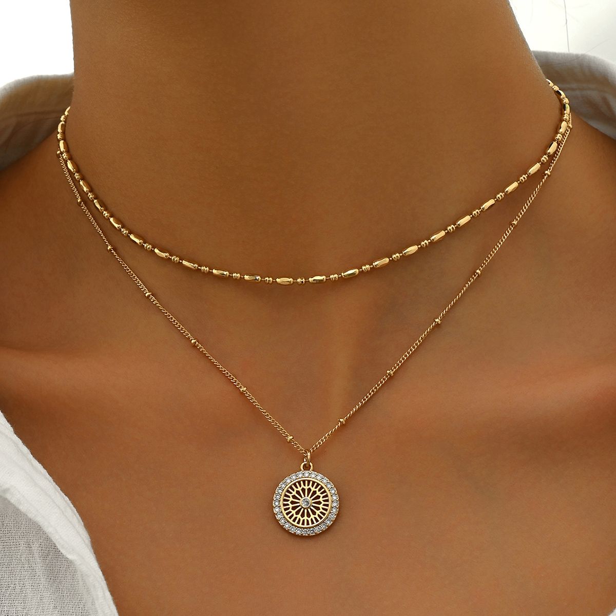 "Elegant Gold Layered Necklace Set with Crystal Medallion  Pendant - Chic and Versatile Jewelry for Women"